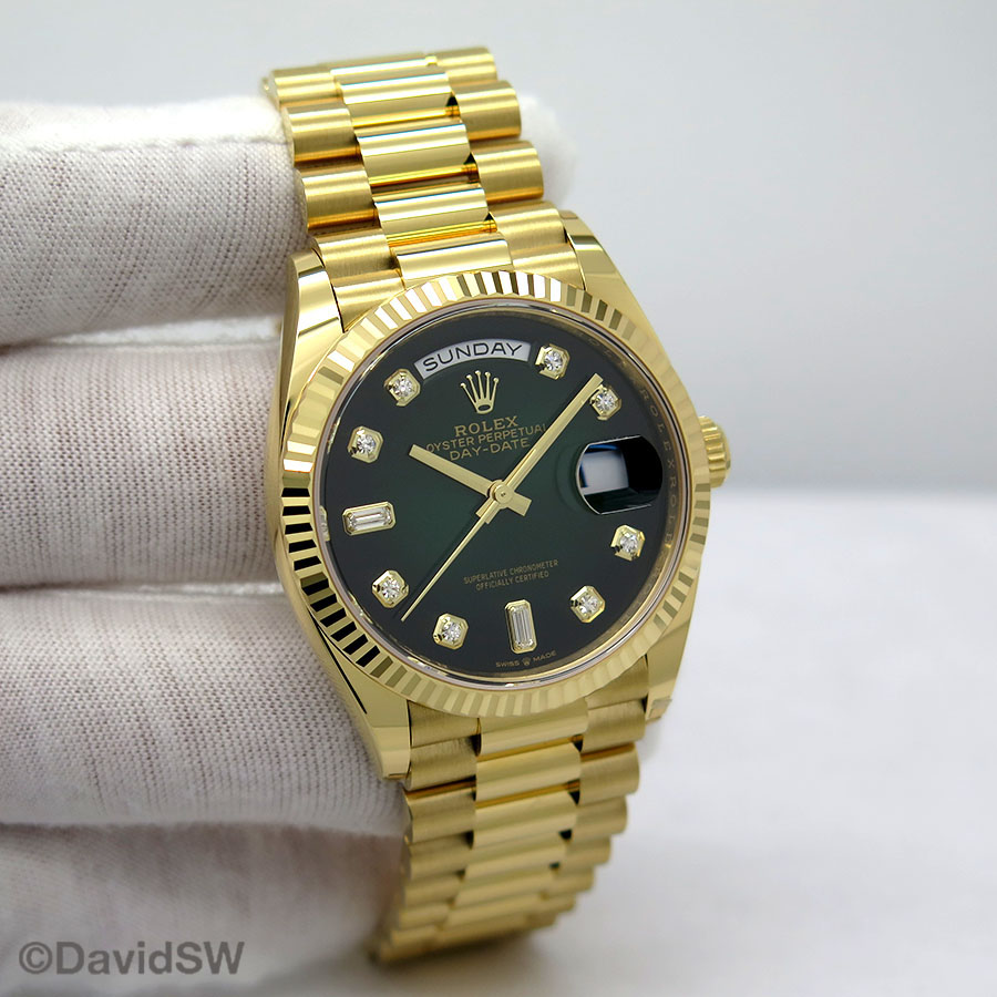 yellow gold day date green dial